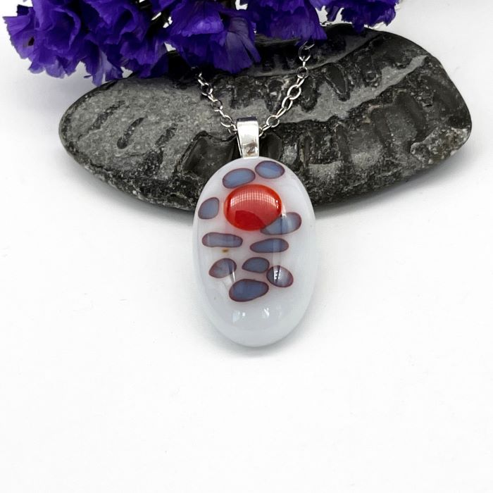 shiny-white-oval-silver-pendant oval shaped fused glass pendant of white, red and blue spot pattern set of a silver chain
