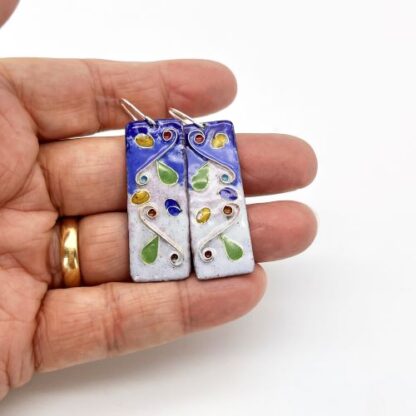 highly patterned cloisonne enamel earrings in blues and pinks on silver ear wires