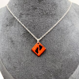 pretty small diamond shaped orange and dark blue enamel pendant on silver chain